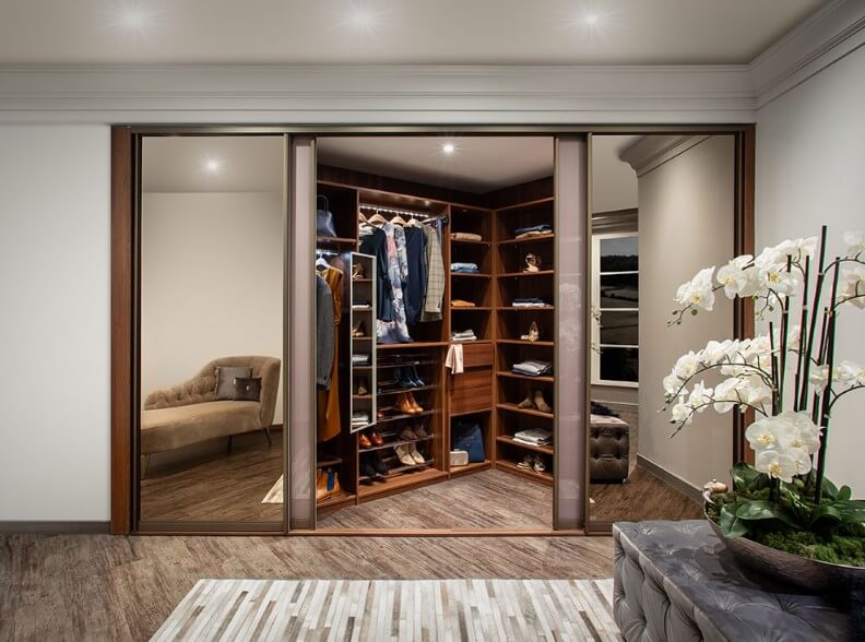 walk in sliding wardrobe with purple and mirrored doors