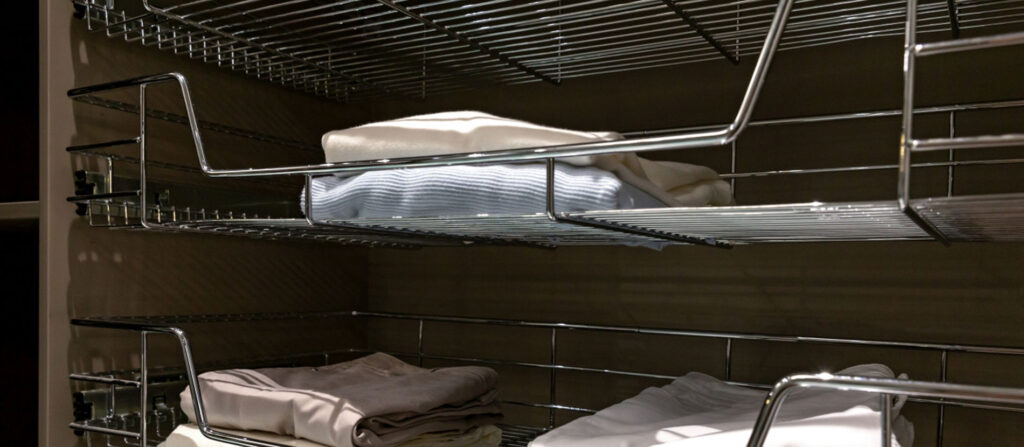 close up of storage rack holding clothes