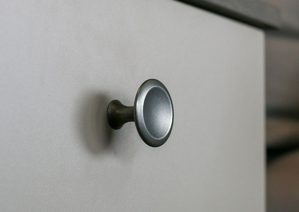 close up of bell antique grey handle