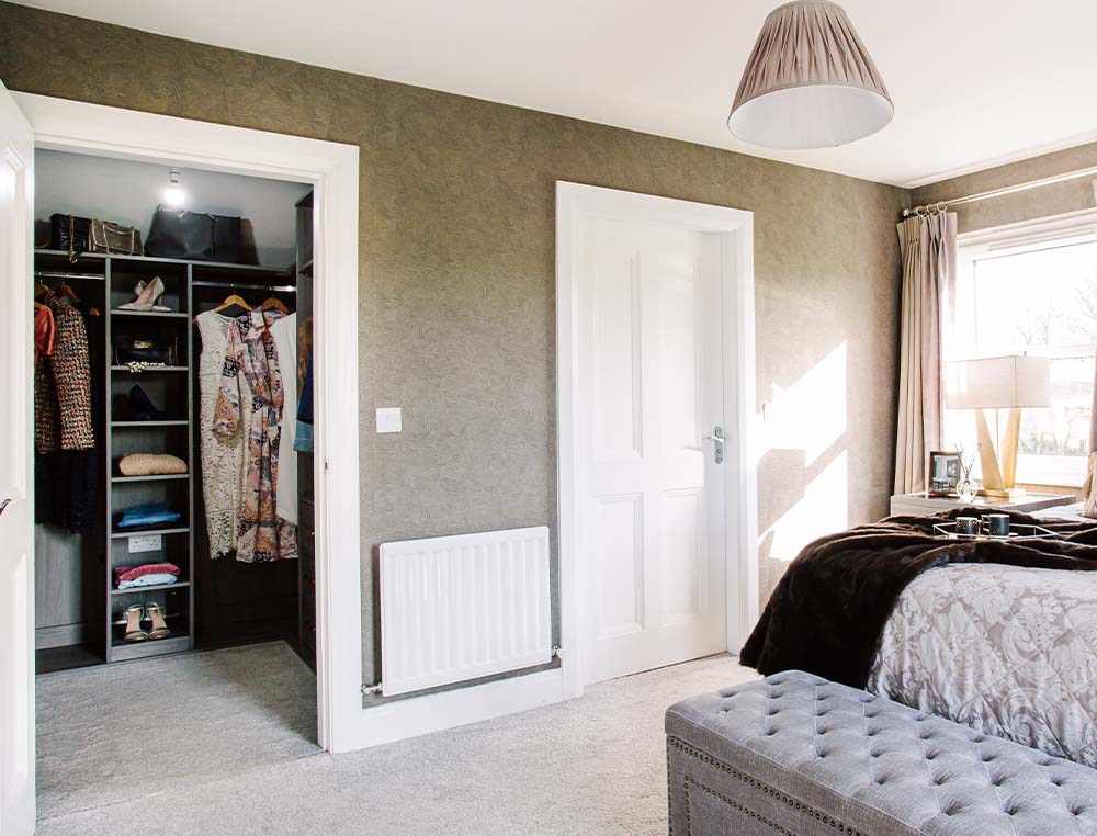 walk in wardrobe in a bedroom