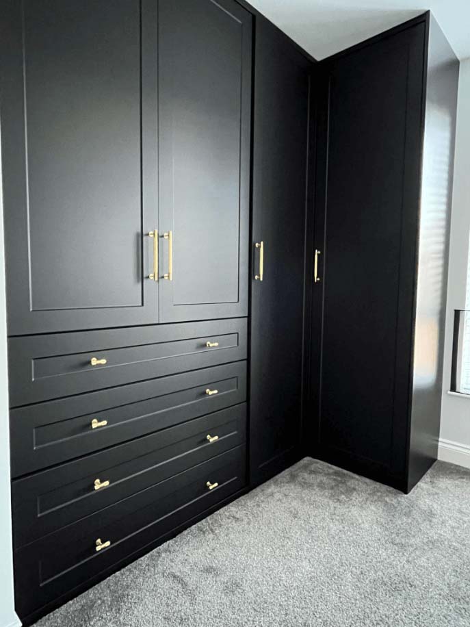 black hinge wardrobe with gold handles