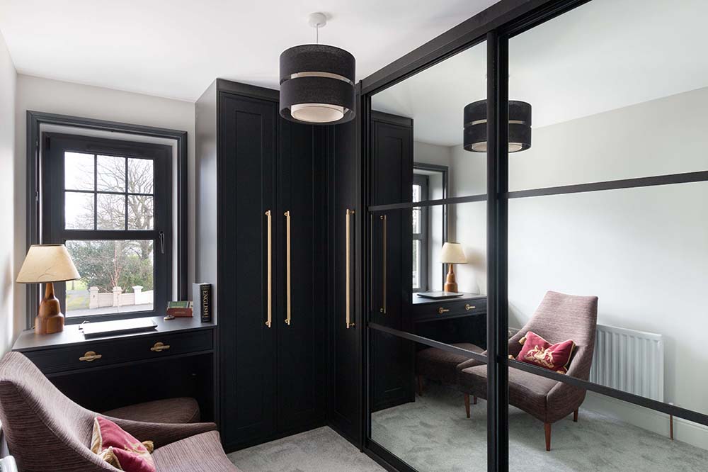 black frame sliding wardrobe with a black hinge wardrobe and home office desk