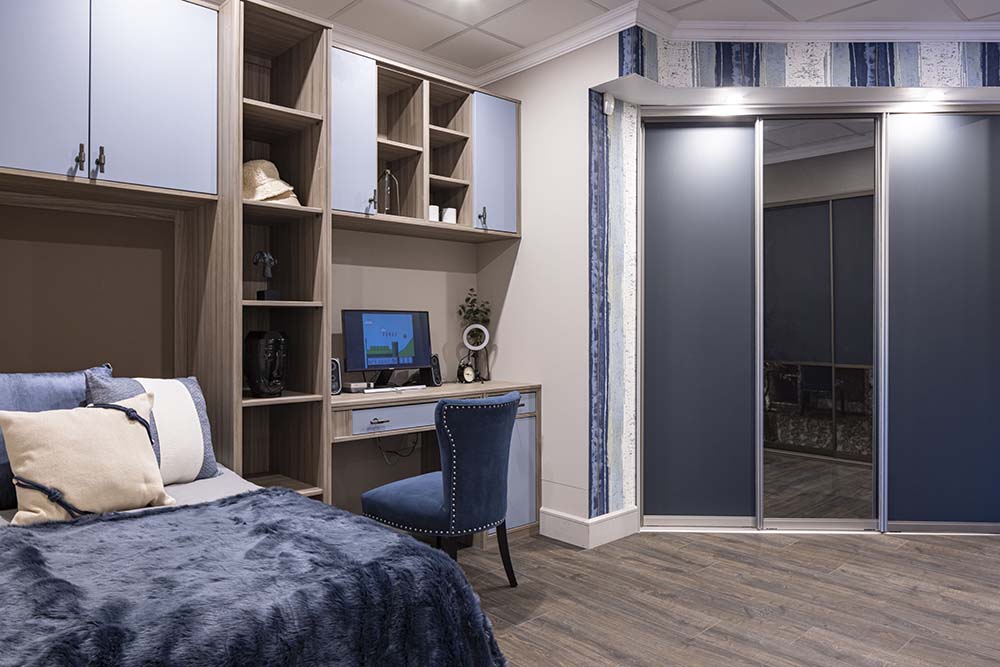 kids room with over bed hinge storage