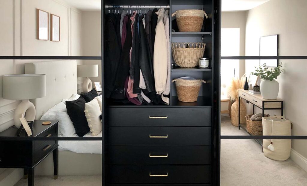 black sliding wardrobe with shelving and drawers