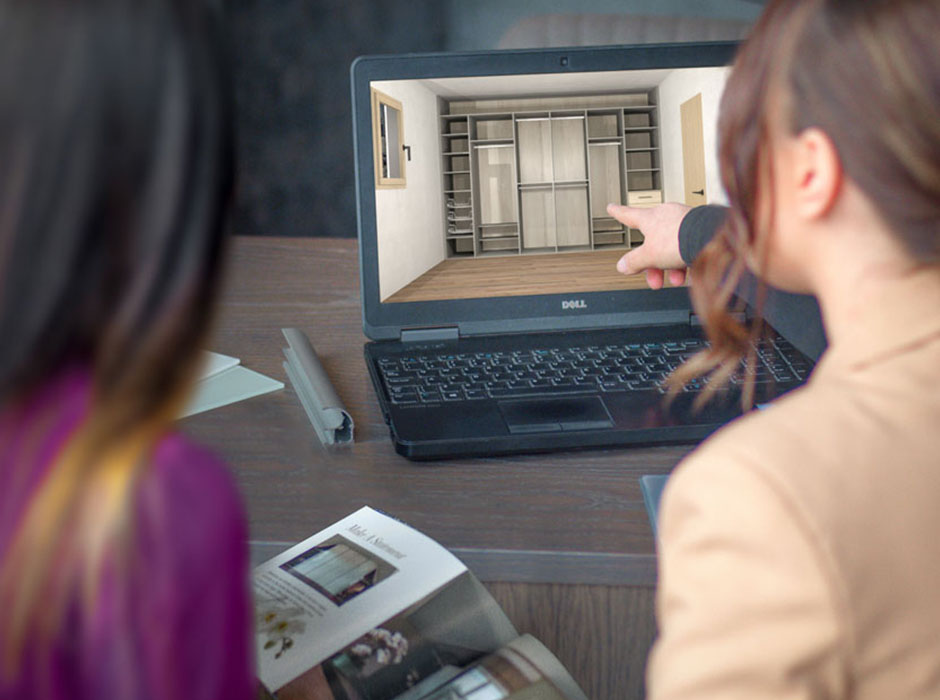 designer showing a customer their wardrobe on cad system